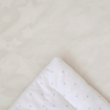 Одеяло на выписку KiDi Звездочки с бантом на резинке демисезонное, молочный 90х90 см